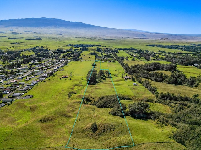 drone / aerial view featuring a mountain view and a rural view