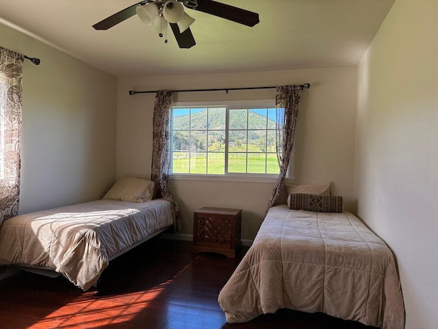 bedroom with hardwood / wood-style flooring and ceiling fan