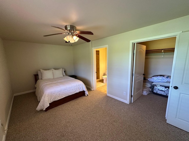 carpeted bedroom featuring connected bathroom, a spacious closet, a closet, and ceiling fan