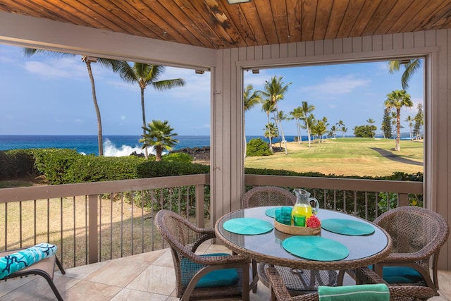 sunroom with a water view