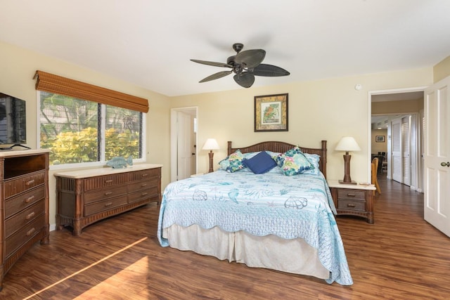 bedroom with ceiling fan and dark wood-type flooring