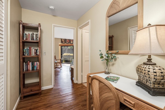 hallway featuring dark hardwood / wood-style flooring