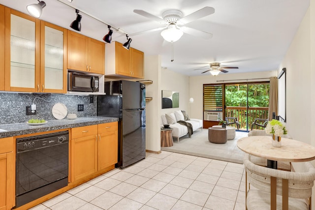 kitchen with decorative backsplash, ceiling fan, cooling unit, black appliances, and light tile patterned floors