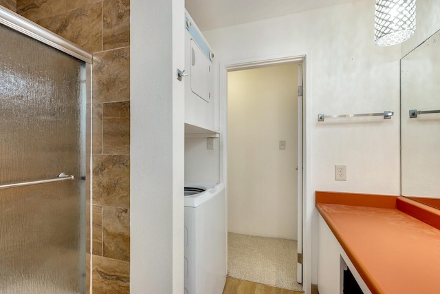 bathroom featuring vanity, a shower with shower door, and hardwood / wood-style flooring