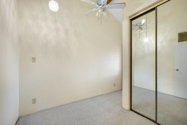 unfurnished bedroom featuring ceiling fan, light colored carpet, and a closet