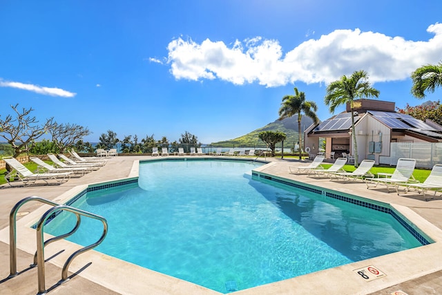 view of swimming pool with a patio