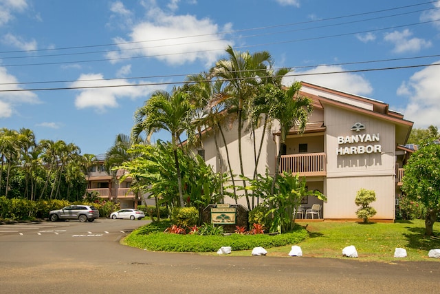 view of front of house featuring a balcony