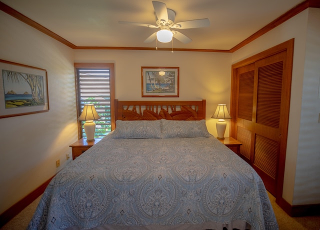 bedroom featuring carpet flooring, ceiling fan, a closet, and crown molding