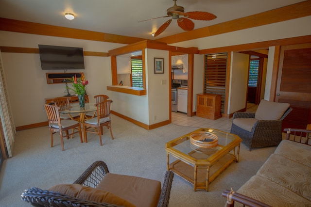 carpeted living room with ceiling fan