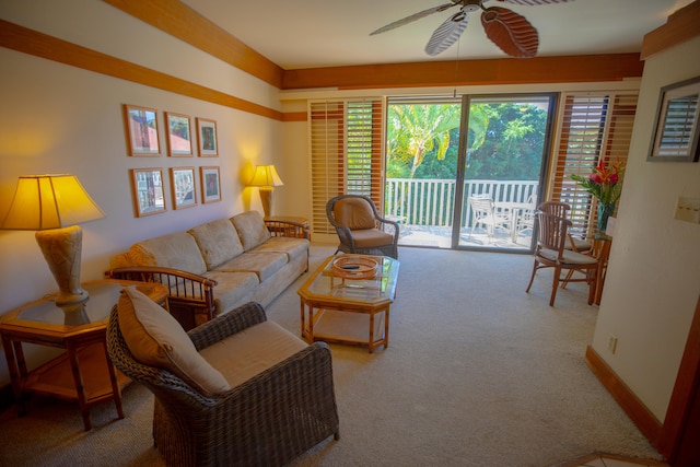 living room featuring light carpet, ceiling fan, and a healthy amount of sunlight