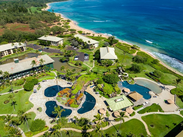 birds eye view of property featuring a water view and a view of the beach