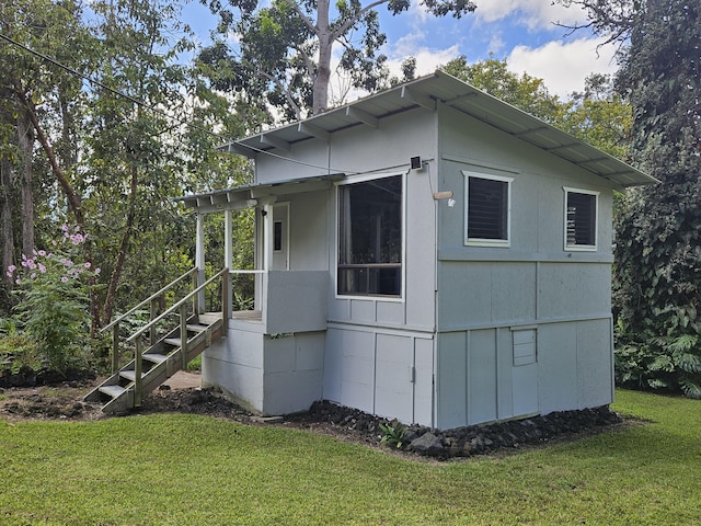 view of property exterior featuring a yard