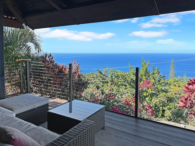 wooden terrace featuring a water view