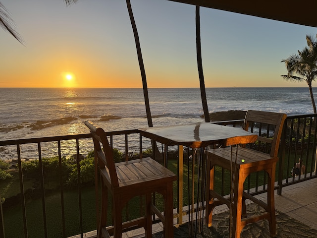 exterior space featuring a water view and a view of the beach