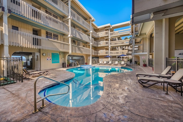 view of swimming pool featuring a patio area