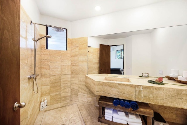 bathroom with tiled shower