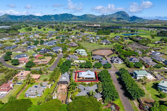 birds eye view of property with a mountain view