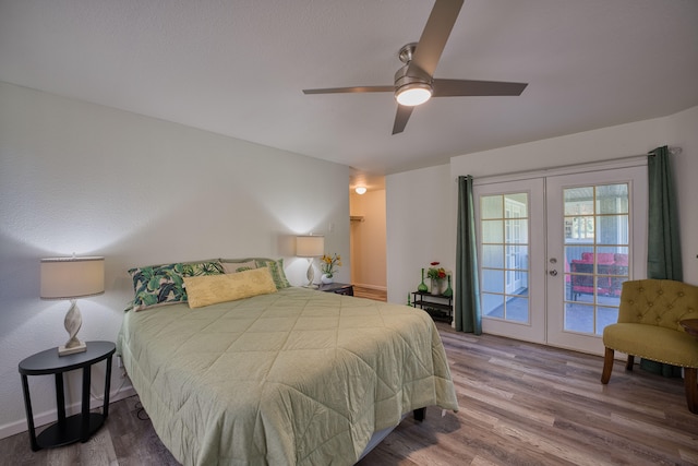 bedroom featuring french doors, access to outside, ceiling fan, and hardwood / wood-style floors