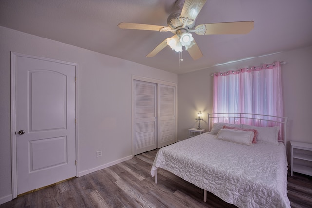 bedroom with hardwood / wood-style floors, ceiling fan, and a closet