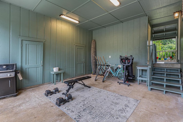 workout room with wood walls