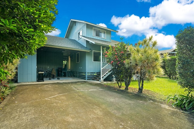 view of front of property with a carport