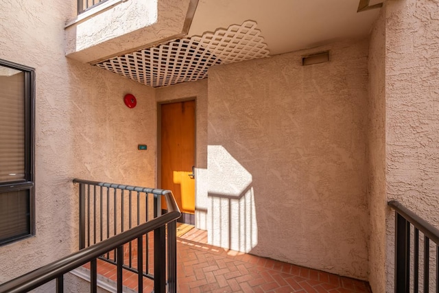 entrance to property featuring a balcony