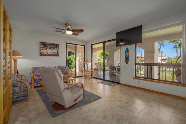 interior space featuring ceiling fan and plenty of natural light