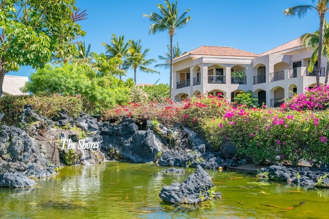 exterior space with a water view