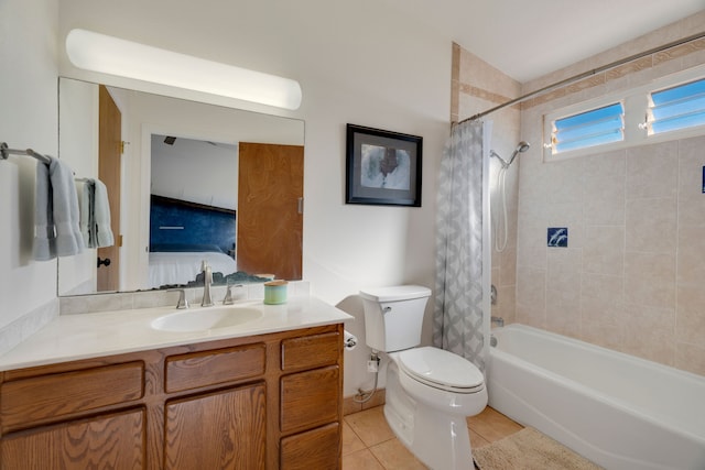 full bathroom featuring tile patterned flooring, vanity, toilet, and shower / bathtub combination with curtain