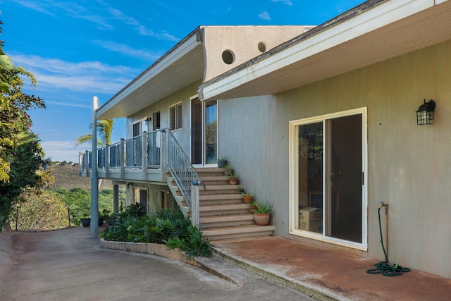 doorway to property with a patio area