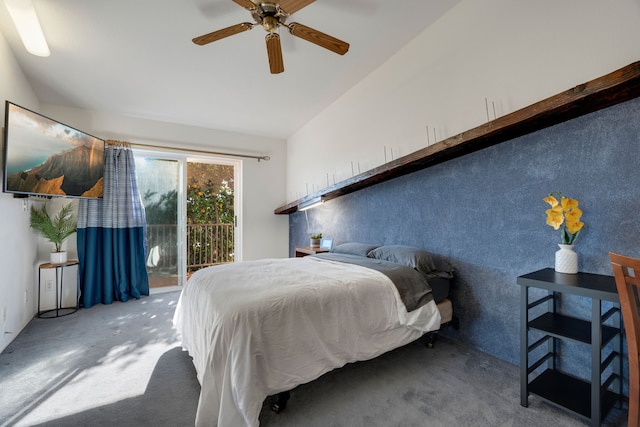 carpeted bedroom featuring access to outside, vaulted ceiling, and ceiling fan