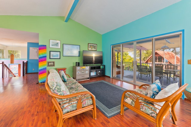 living room featuring vaulted ceiling with beams and hardwood / wood-style floors