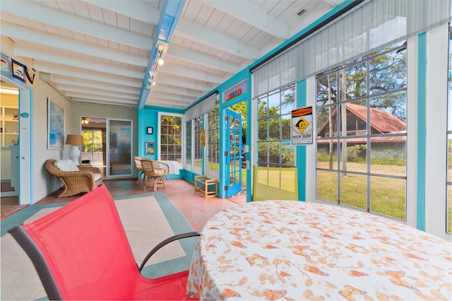 sunroom / solarium with beamed ceiling