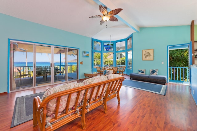 bedroom featuring access to exterior, wood-type flooring, a water view, and multiple windows