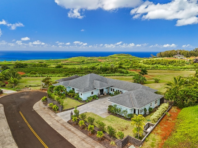 birds eye view of property with a water view