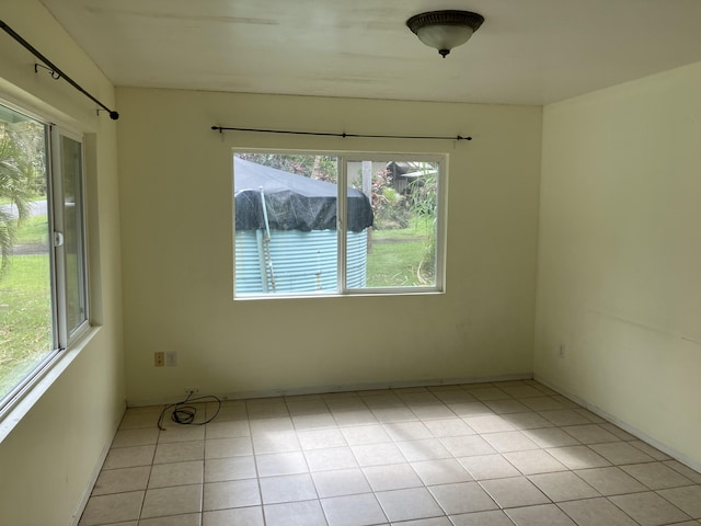 unfurnished room with light tile patterned floors