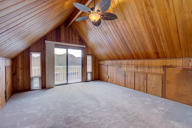 additional living space featuring light carpet, lofted ceiling, and wood ceiling