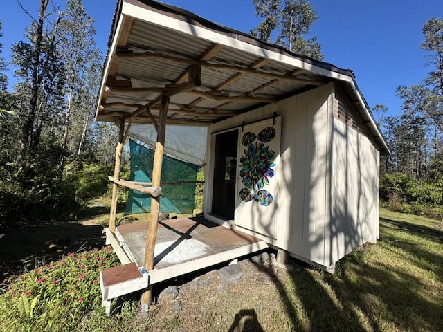 view of outbuilding featuring a yard