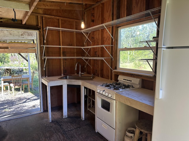 kitchen with white appliances and sink