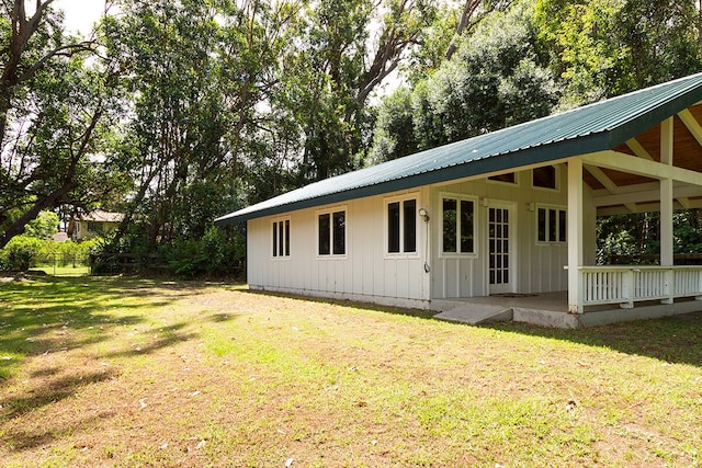 back of house with a yard