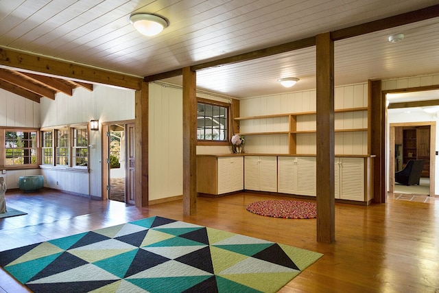 interior space featuring hardwood / wood-style floors, wood walls, and wood ceiling