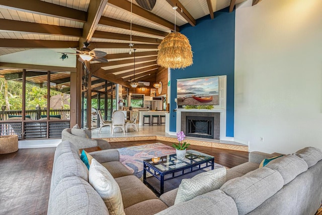 living room featuring wood-type flooring, vaulted ceiling with beams, wooden ceiling, and a fireplace