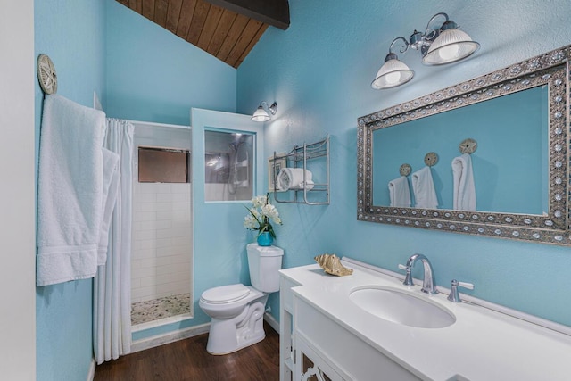 bathroom with lofted ceiling, hardwood / wood-style floors, vanity, curtained shower, and toilet