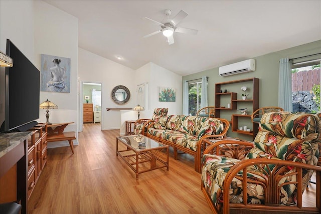 living room featuring ceiling fan, plenty of natural light, light hardwood / wood-style floors, and lofted ceiling