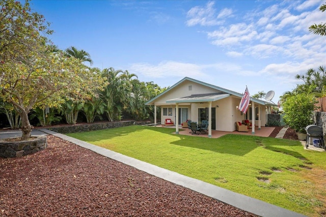 view of front of house featuring a patio and a front lawn