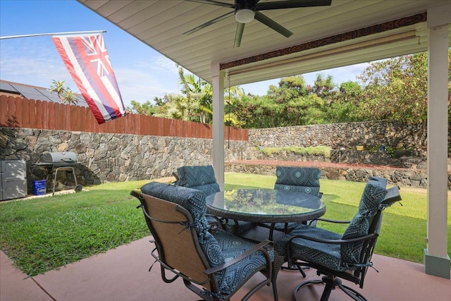 view of patio featuring area for grilling and ceiling fan