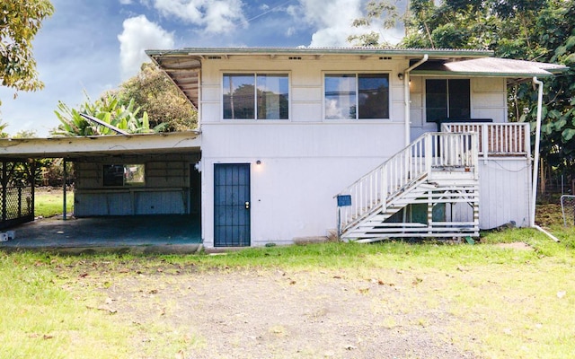 view of front of property with a carport