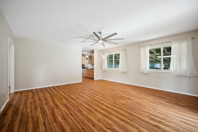 empty room featuring ceiling fan and light hardwood / wood-style flooring