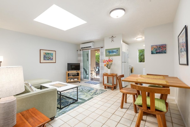 tiled living room featuring a skylight and an AC wall unit