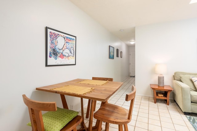 dining area featuring light tile patterned floors